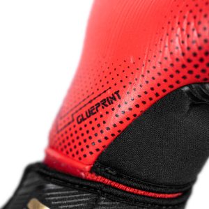 NAME: Fastgrip Gold X GluePrint // PALM: Reusch Grip Gold X // CUT: Hybrid Negative Cut // FEATURES: Extended Grip Zone, GluePrint, Ventilation channels, Preshaped Construction, 3D Thumb Crotch, Double Thumb Wrap, Side Wrap, AdaptiveFlex Closure System // COLOUR: 7075 black / gold / fiery red