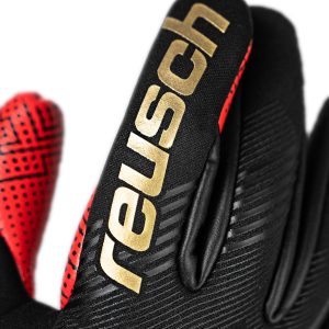 NAME: Fastgrip Gold X GluePrint // PALM: Reusch Grip Gold X // CUT: Hybrid Negative Cut // FEATURES: Extended Grip Zone, GluePrint, Ventilation channels, Preshaped Construction, 3D Thumb Crotch, Double Thumb Wrap, Side Wrap, AdaptiveFlex Closure System // COLOUR: 7075 black / gold / fiery red